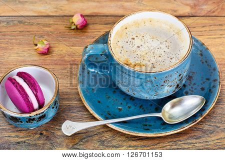 Sweet  French Macaroons with Cofee Cup. Studio Photo