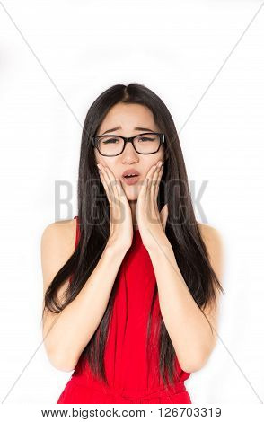 Sad girl  with an open mouth on a white background