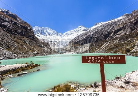 Llaca lagoon (4474 m) in the peruvian Andes and Ocshapalpa peak (5888 m) and Ranrapalca peak (6162 m), Peru.