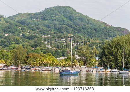 Victoria Mahe island Seychelles - December 16 2015: Beautiful yachts and boats in the harbor of Port Victoria Mahe island Seychelles. Victoria is the capital city of the Seychelles and is situated on the north-eastern side of Mahe island the archipelago's