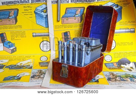 Vintage Soviet military individual radiometers set DP-24.Background - poster Soviet Civil Defense: Sets of individual radiometers DP-24 & DP-22v,design and usage(60-th).At April 19,2016  Kiev,Ukraine