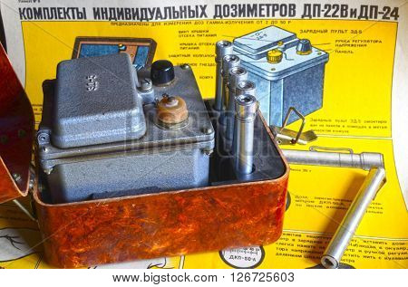 Vintage Soviet military individual radiometers set DP-24.Background - poster Soviet Civil Defense: Sets of individual radiometers DP-24 & DP-22v,design and usage(60-th).At April 19,2016  Kiev,Ukraine