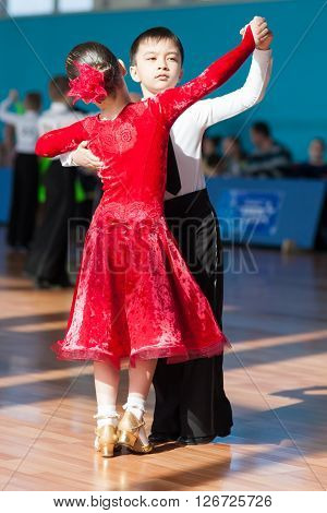 Minsk Belarus -April 3 2016: Unidentified Dance Couple Performs Juvenile-1 Standard European Program on the IDSA Championship Kinezis Star Cup - 2016 in April 3 2016 in Minsk Republic of Belarus