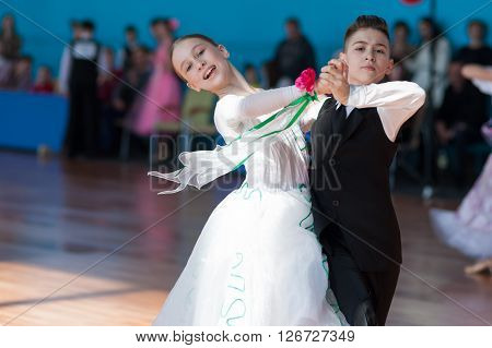 Minsk Belarus -April 3 2016: Panasyuk Maksim and Belyankina Liana Perform Juvenile-1 Standard Program on the IDSA Championship Kinezis Star Cup - 2016 in April 3 2016 in Minsk Republic of Belarus