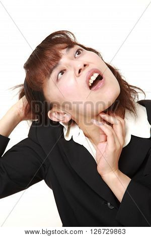 studio shot of demented businesswoman on white background