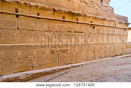 The wall of the Khonsu Temple with the ancient hieroglyphs and pictures Karnak Complex Luxor Egypt.