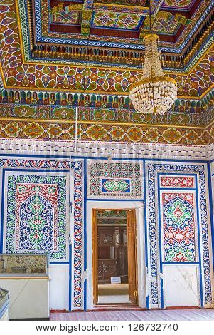 KOKAND UZBEKISTAN - MAY 6 2015: The interior of the Small Throne Room of Khudayar Khan Palace covered by traditional Eastern ornaments on May 6 in Kokand.