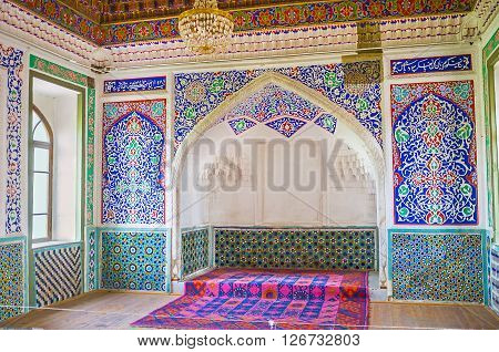 KOKAND UZBEKISTAN - MAY 6 2015: The interior of the Great Throne Room in Khudayar Khan Palace with the carved and painted patterns on the walls on May 6 in Kokand.