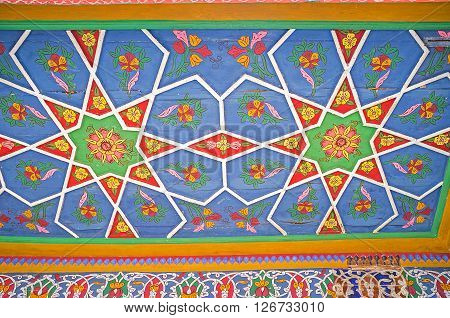 KOKAND UZBEKISTAN - MAY 6 2015: The ceiling in Khudayar Khan Palace covered with the unique patterns with the octagonal stars on May 6 in Kokand.