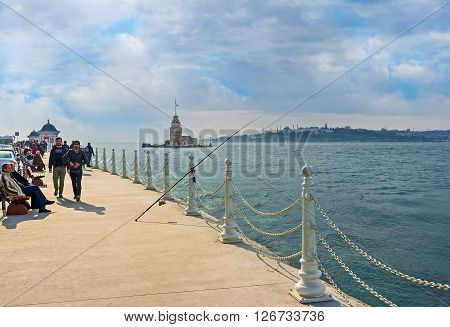 ISTANBUL TURKEY - JANUARY 21 2015: The Uskudar embankment is the best place to enjoy the Maiden's Tower on January 21 in Istanbul.