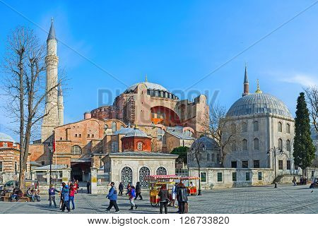 ISTANBUL TURKEY - JANUARY 21 2015: The magnificent Hagia Sophia Temple with the white stone minarets huge dome and the medieval mausoleums in front of it on January 21 in Istanbul.
