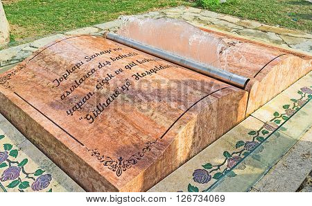 ISTANBUL TURKEY - JANUARY 21 2015: The marble book fountain in the Gulhane park with the jet of water in the form of page on January 21 in Istanbul.