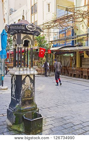 ISTANBUL TURKEY - JANUARY 21 2015: The tiny ablution fountain next to the entrance to the Hamidiye Turbesi (tombs) on January 21 in Istanbul.