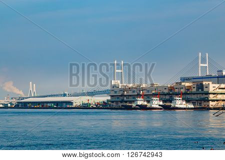 YOKOHAMA JAPAN - NOVEMBER 24 2015: Yokohama Port has 10 major piers. In 2013 the Port served 37706 ships. It handled 271276977 tons of cargo and 2888220 TEU containers