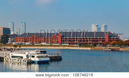 YOKOHAMA JAPAN - NOVEMBER 24 2015: Yokohama Port has 10 major piers. In 2013 the Port served 37706 ships. It handled 271276977 tons of cargo and 2888220 TEU containers