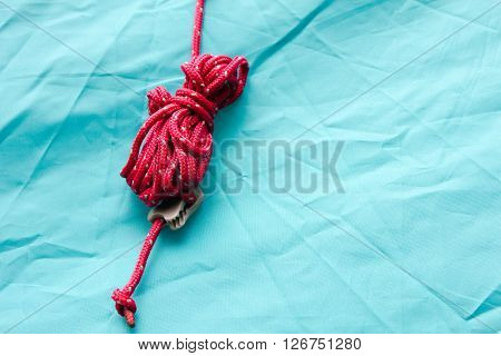 Rope on a camp tent closeup green
