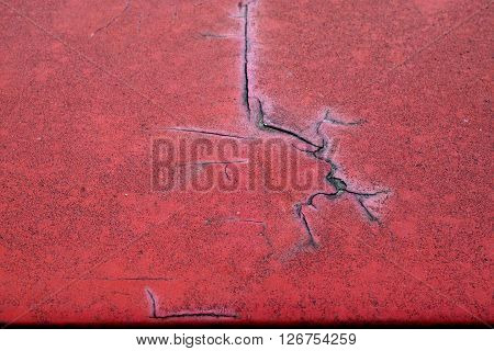 Cracked Red Paint On Grunge Metal Surface - Macro 1