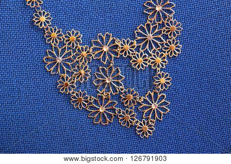 Picture of a Bijoux necklace on a fabric background