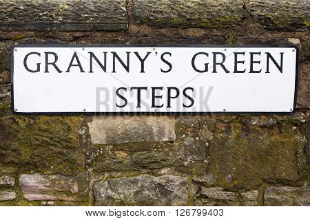 The street sign for Grannys Green Steps in the historic city of Edinburgh Scotland.