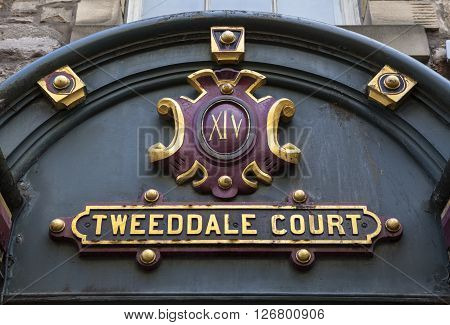 The sign above the entrance to Tweeddale Court along the Royal Mile in Edinburgh Scotland.