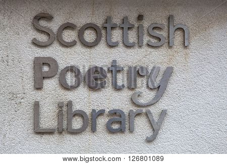 EDINBURGH SCOTLAND - MARCH 8TH 2016: The sign on the exterior of the Scottish Poetry Library located in Crichtons Close off of The Royal Mile in Edinburgh on 8th March 2016.