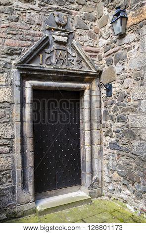 An entrance to Acheson House in the historic city of Edinburgh Scotland. The house was built in 1633 (as the marking above the door notes) and was built for Sir Archibald Acheson Secretary of State of Scotland for King Charles 1st.
