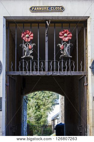 EDINBURGH, UK - MARCH 2016: Poppy Sculptures above the entrance to the historic Panmure Close in Edinburgh Scotland, in March 2016. The Close was the former home of Lady Haigs Poppy Factory.