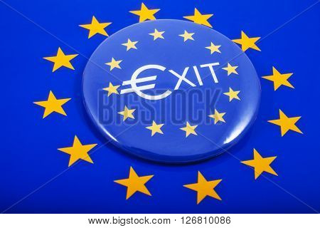 An EXIT Pin Badge displayed over the European Union flag in reference to the upcoming referendum on Britain's membership to the European Union.