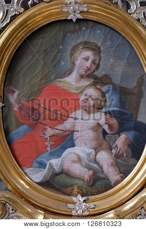 URSBERG, GERMANY - JUNE 09: Virgin Mary with baby Jesus, altarpiece in the monastery church of St. John in Ursberg, Germany on June 09, 2015.