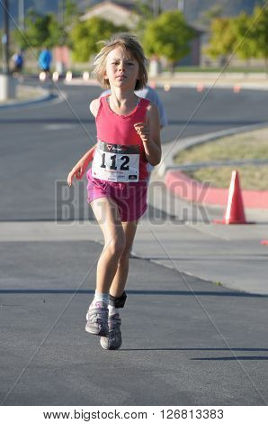 Hemet California/USA-April 17 2016:kid running in the Diamond Valley Triathlon