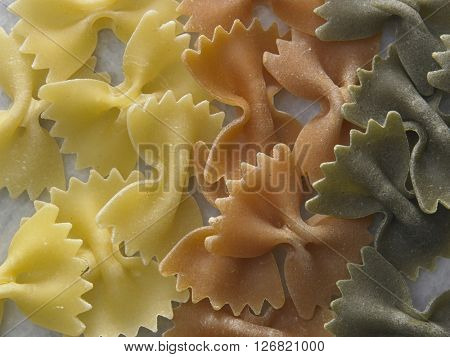 dry farfalloni pasta on the marble top