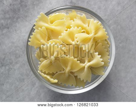 dry farfalloni pasta on the marble top