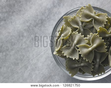 dry farfalloni pasta on the marble top
