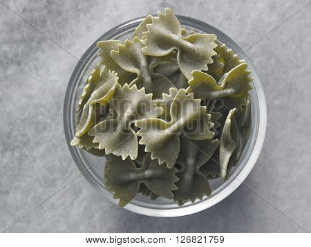 dry farfalloni pasta on the marble top