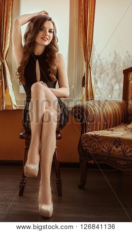 Sexy beautiful girl in underclothes in her bedroom