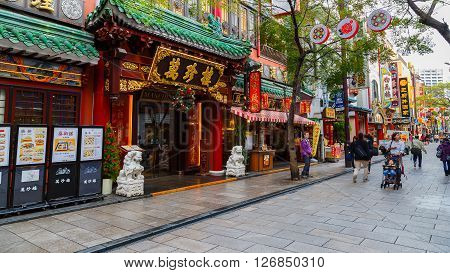 YOKOHAMA JAPAN - NOVEMBER 24 2015: Yokohama Chinatown is Japan's largest chinatown. A large number of Chinese stores and restaurants can be found in the narrow and colorful streets