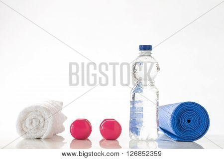 Fitness concept with water, accessories of musculation and fruit