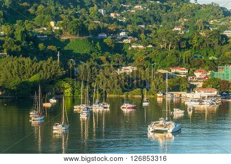 Victoria Mahe island Seychelles - December 15 2015: Beautiful yachts and boats in the morning sun in the harbor of Port Victoria Mahe island Seychelles.