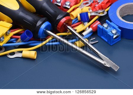 Electrical component kit to use in electrical installations on blue metal background
** Note: Shallow depth of field