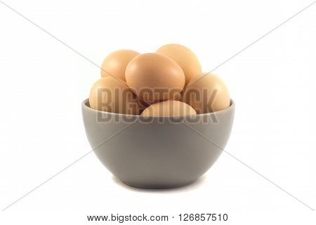 eggs in a cup and isolated white background