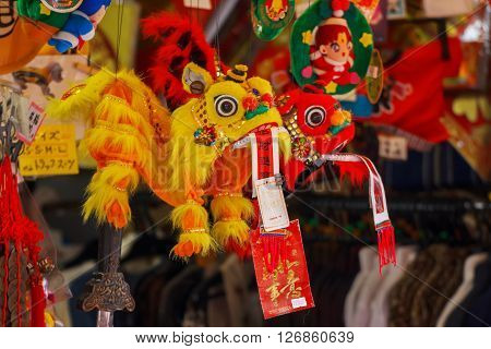 YOKOHAMA JAPAN - NOVEMBER 24 2015: Chinese lion dolls in a souvenir shop in a street of Yokohama Chinatown