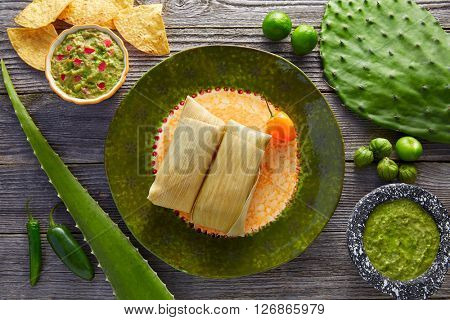 Mexican Tamale tamales of corn leaves with chili and sauces