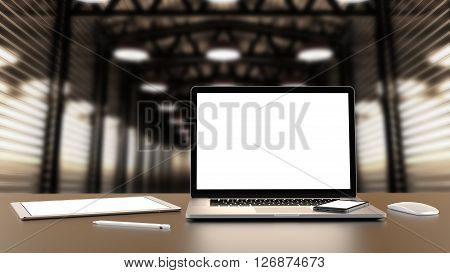 Laptop, tablet, smartphone, mouse,and pencil on the background of the hall.