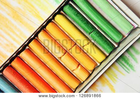 The colored dry postels close up background.