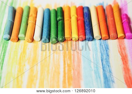 The colored dry postels close up background.