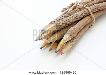 Brown wooden pencils isolated on white baclground.
