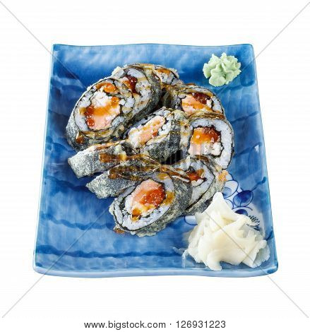 Sushi rolls with tuna and flying fish roe on a plate with wasabi and ginger. Side view. Isolated on white background. Include clipping path.