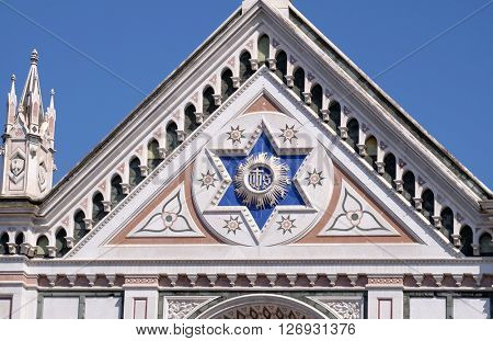 FLORENCE, ITALY - JUNE 05: IHS sign, Basilica di Santa Croce (Basilica of the Holy Cross) - famous Franciscan church in Florence, Italy, on June 05, 2015