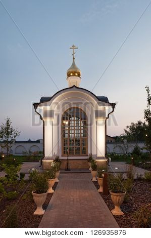 The orthodox baptistery chapel. Evening architectural lighting.