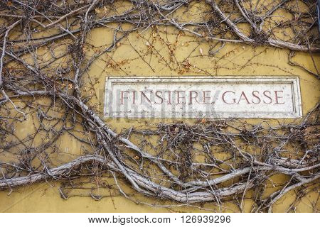 Augsburg Germany - January 17 2016: Street name in Fuggerei.The Fuggerei is the world's oldest social housing complex still in use. It is a walled enclave within the city of Augsburg Bavaria.
